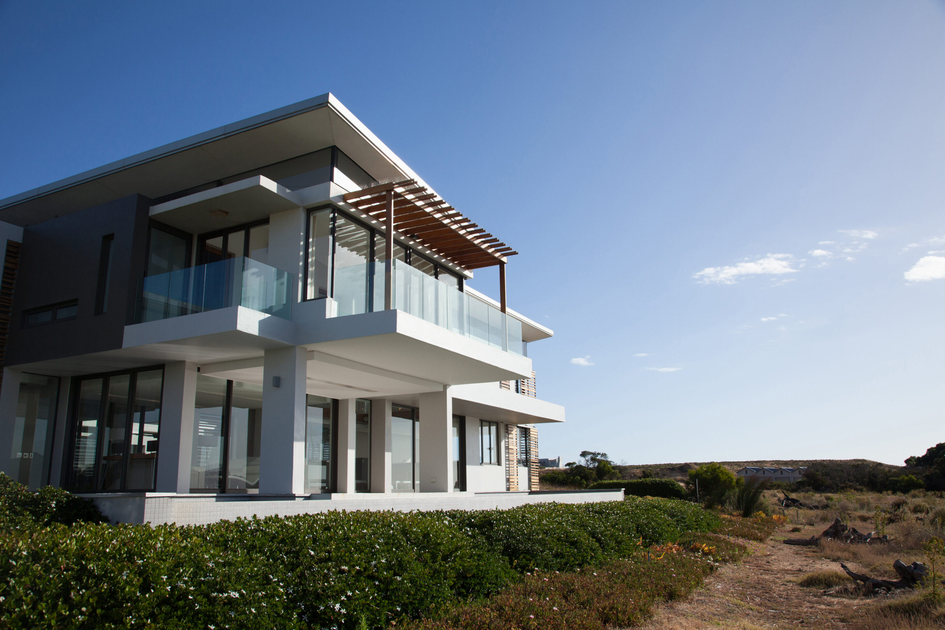 Modern beachfront house with glass balconies