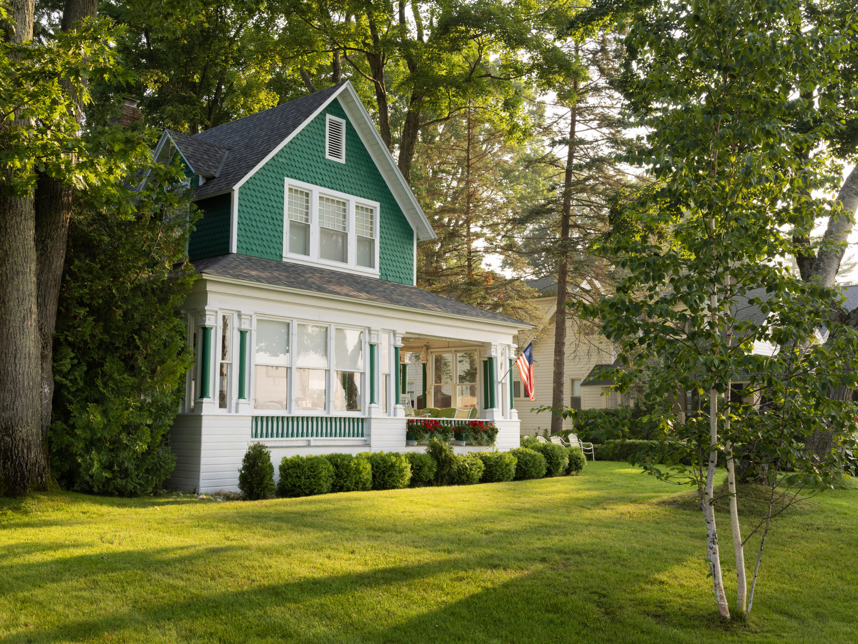 Green house with American flag